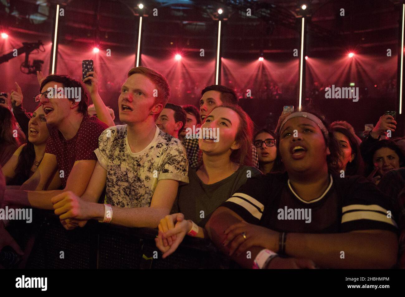The crowd watches Sam Smith's performance on stage at the iTunes ...