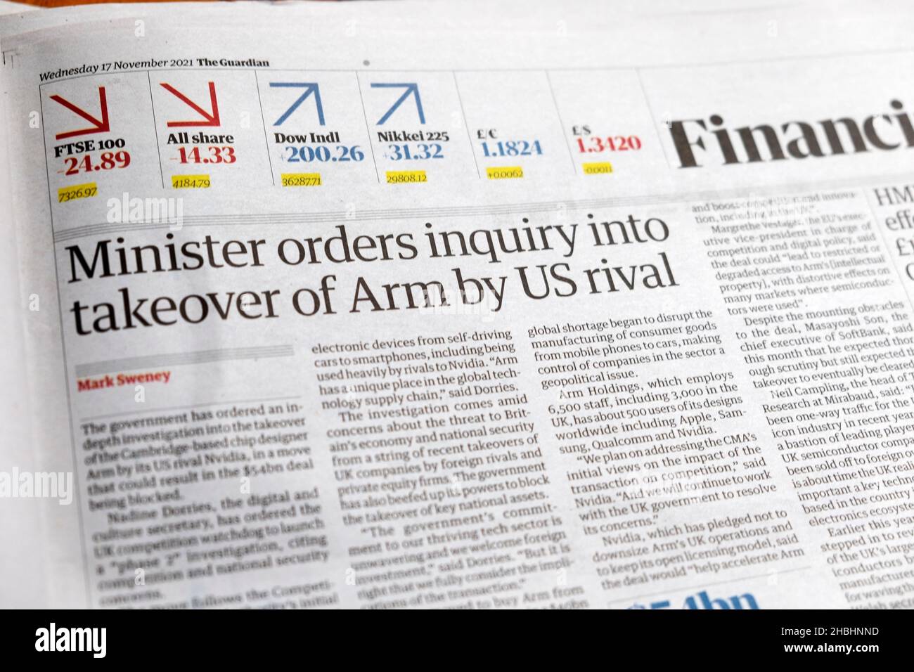 'Minister orders inquiry into takeover of Arm by US rival' Guardian newspaper headline clipping article 17 November 2021 London England UK Stock Photo