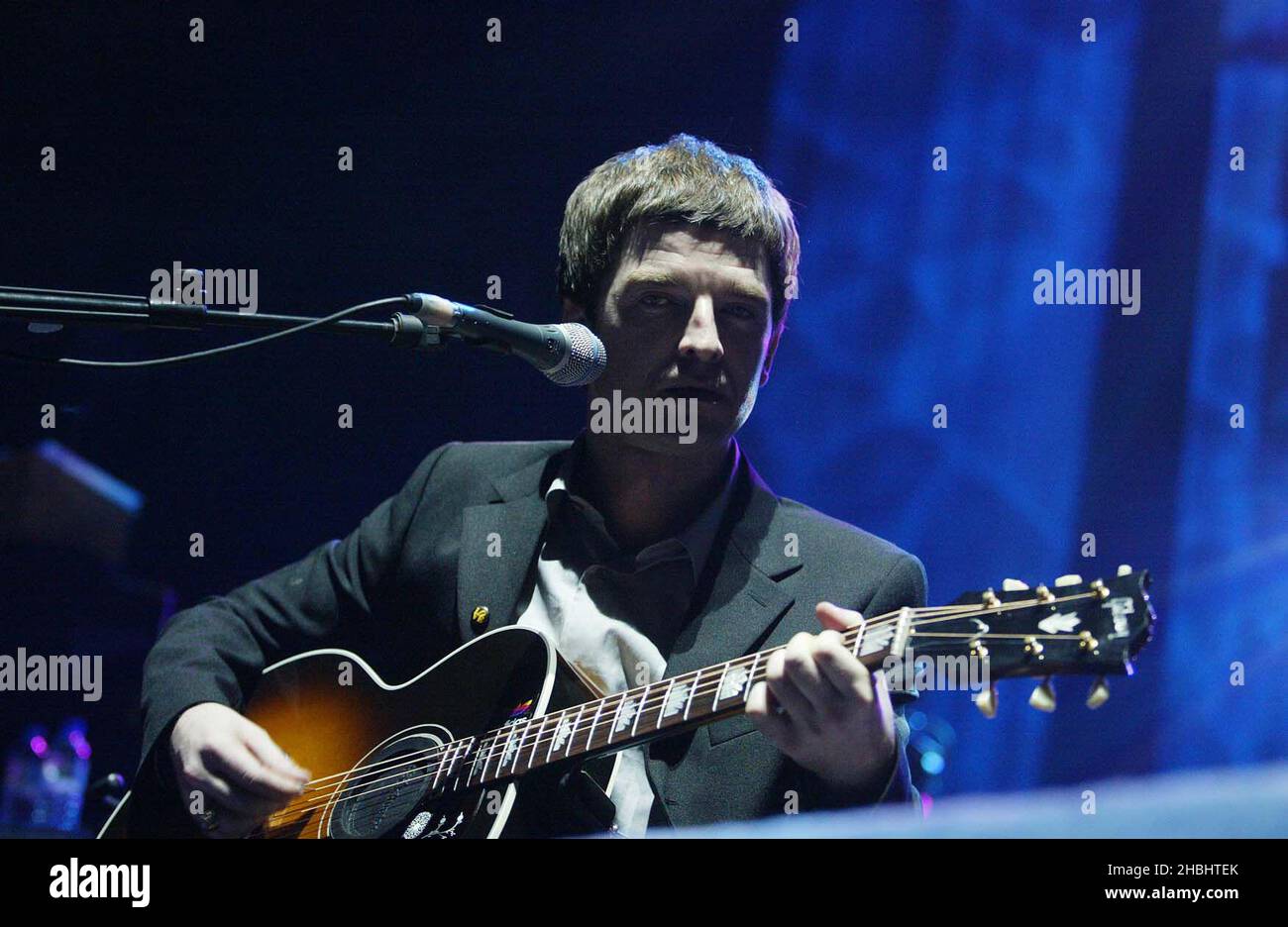 Noel Gallagher performing live on stage at the Teenage Cancer Trust Concert at the Royal Albert Hall London. Live. Half Length. Stock Photo