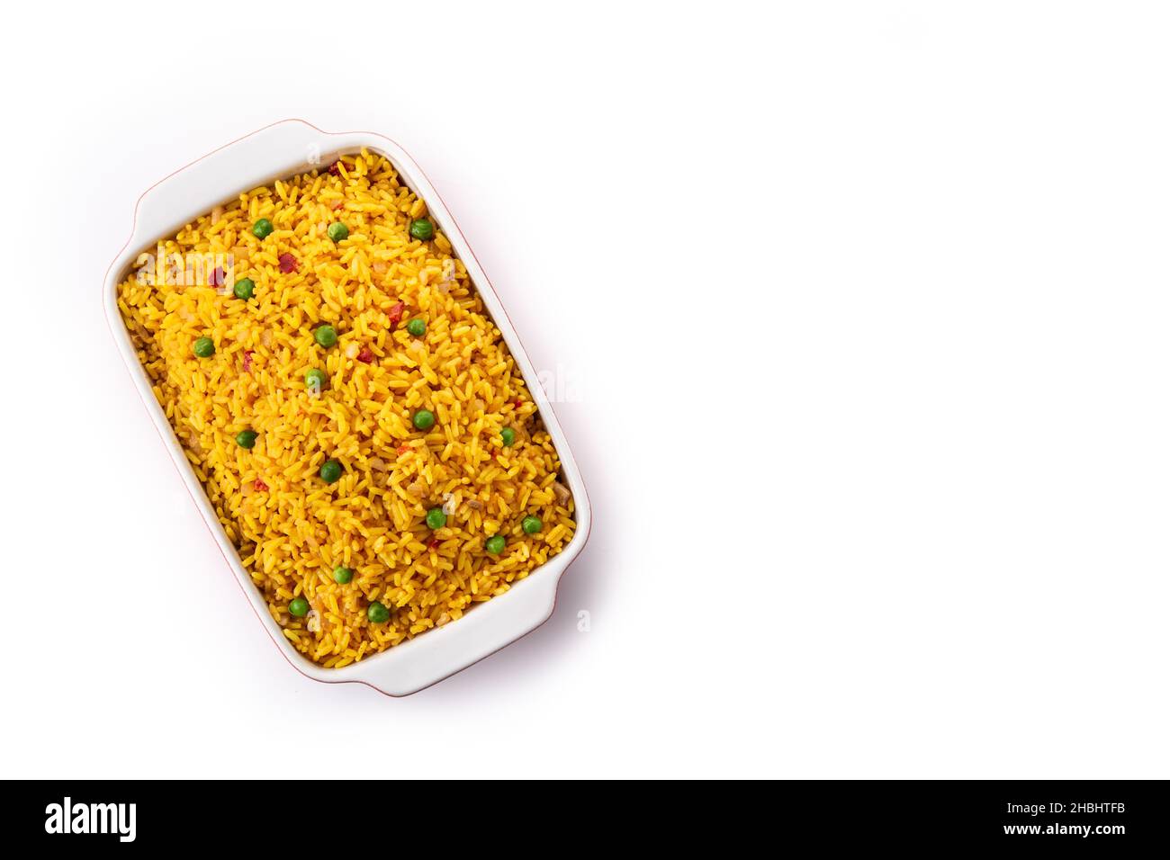 Traditional Mexican rice served with green peas isolated on white