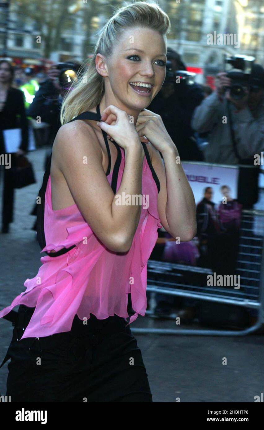 Hannah Spearritt stepping out of the car at the S Club Premiere at the West End Village, Leicester Square, London. 1/2 length. see through top Stock Photo