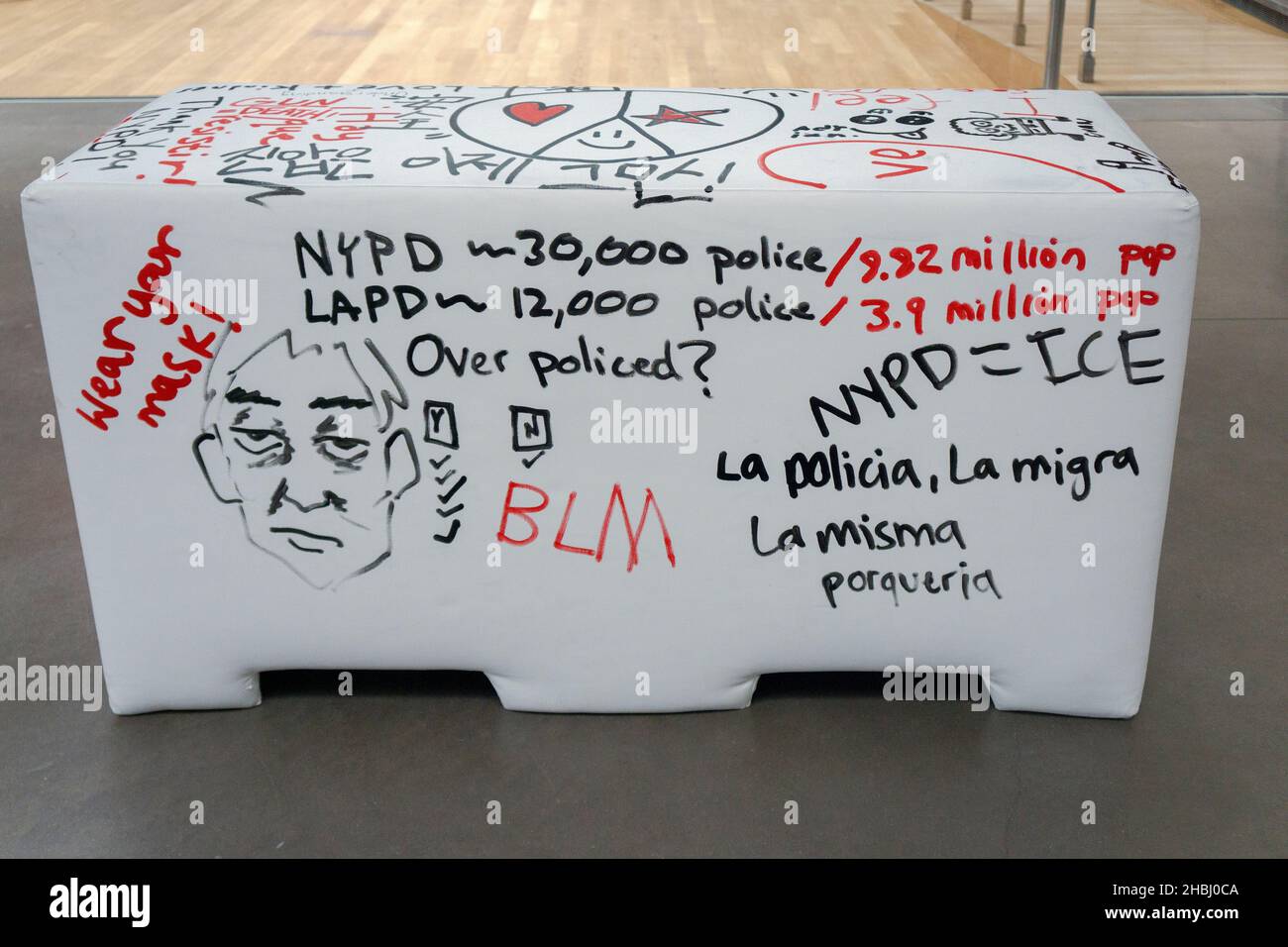 A plywood and foam imitation of an NYPD police barrier that viewers are invited to write on. At the Queens Museum in Flushing Meadows Corona Park, NYC Stock Photo