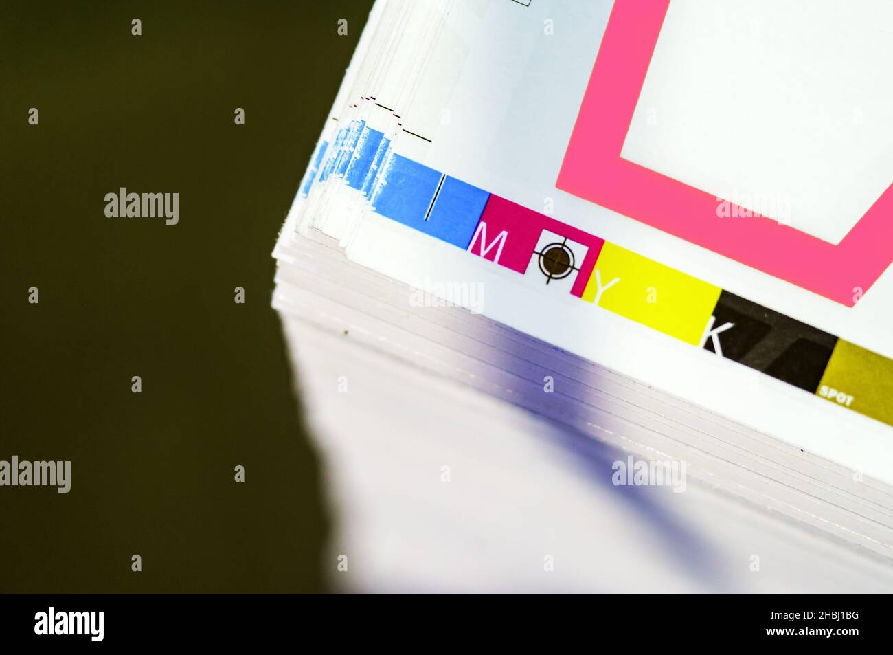 Offset printing. Sheets of printed products. CMYK press. Paper at the ...