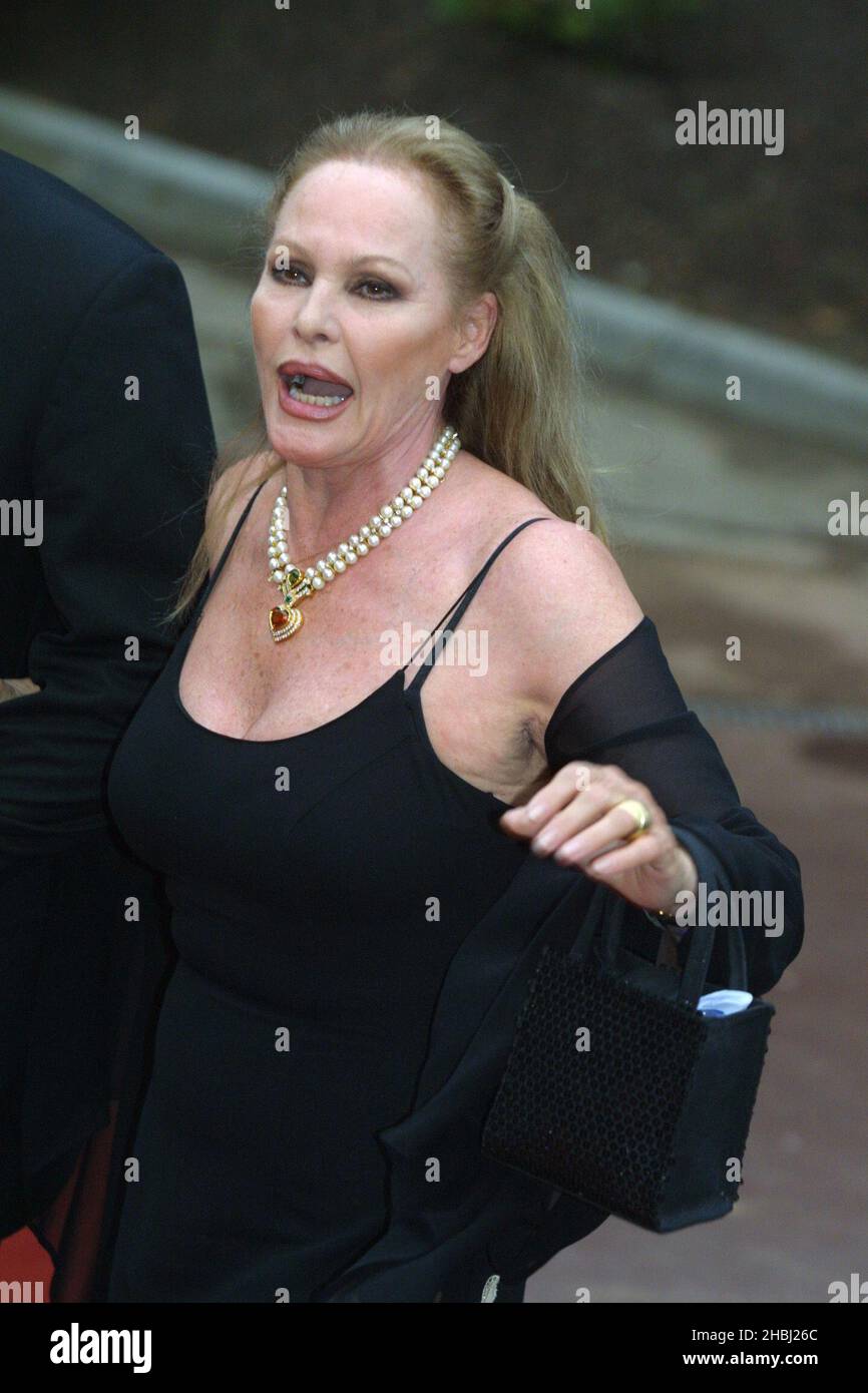 Ursula Andress at the Monte Carlo Music Awards which took place in Monte Carlo. Half Length. black dress, black handbag, necklace. Stock Photo