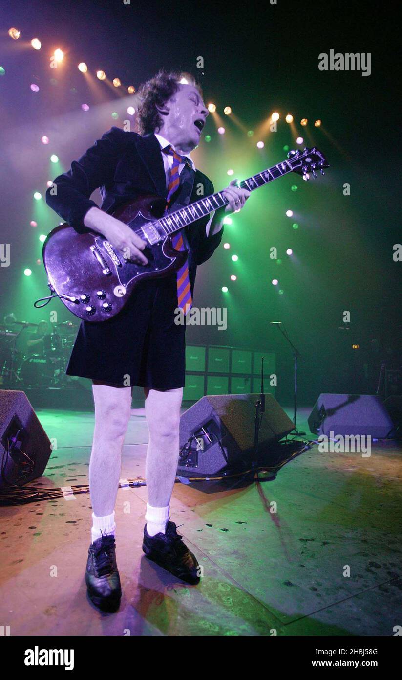 Angus Young and ACDC perform live on stage at the Hammersmith Apollo in London. Stock Photo