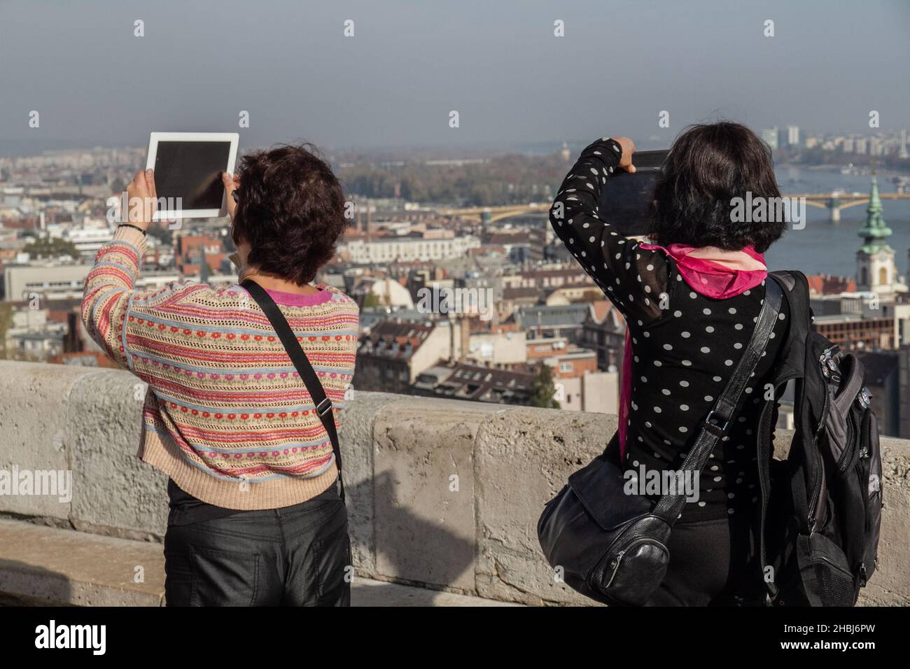 Tourists taking photos of Budapest with tablets Stock Photo
