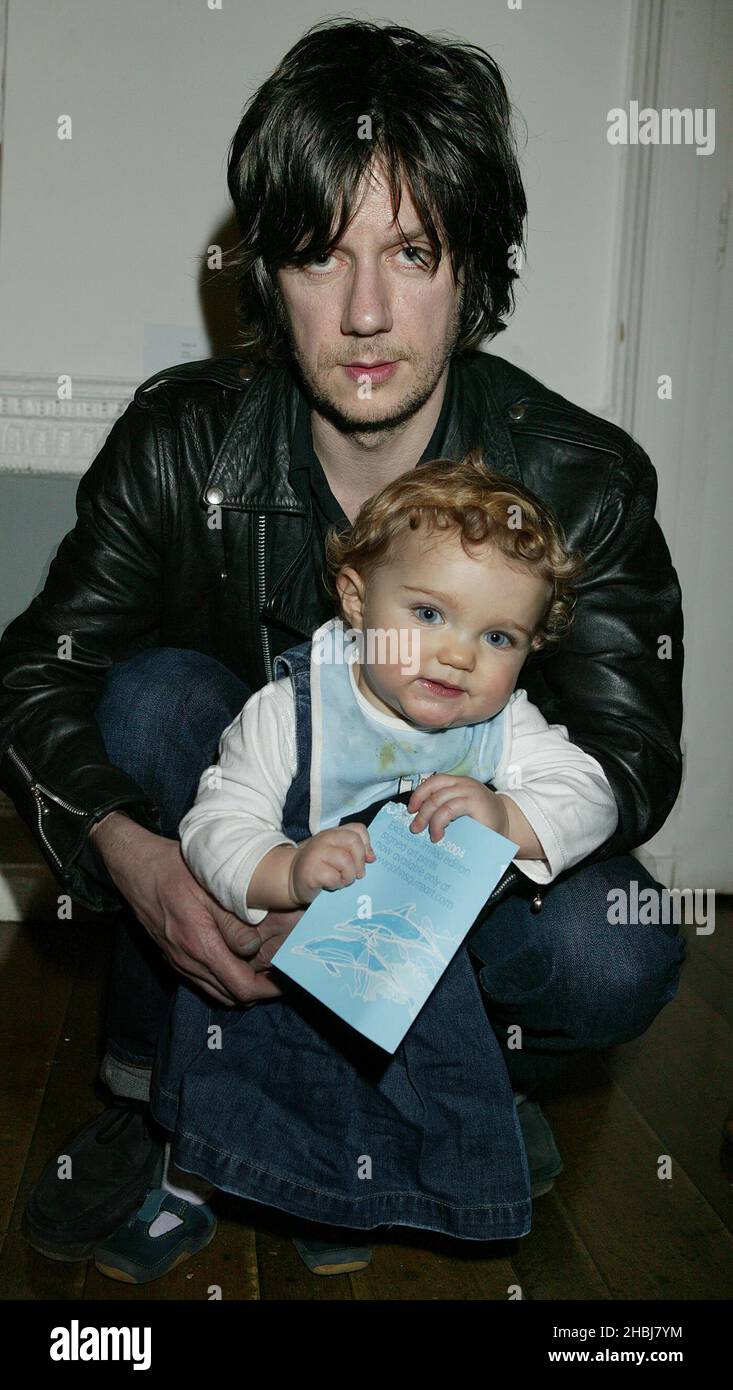 John Squires of Stone Roses with his youngest daughter Martha at his art exhibition at the ICA The Mall in London      EXCLUSIVE PICTURES FROM ALL ACTION DIGITAL Stock Photo