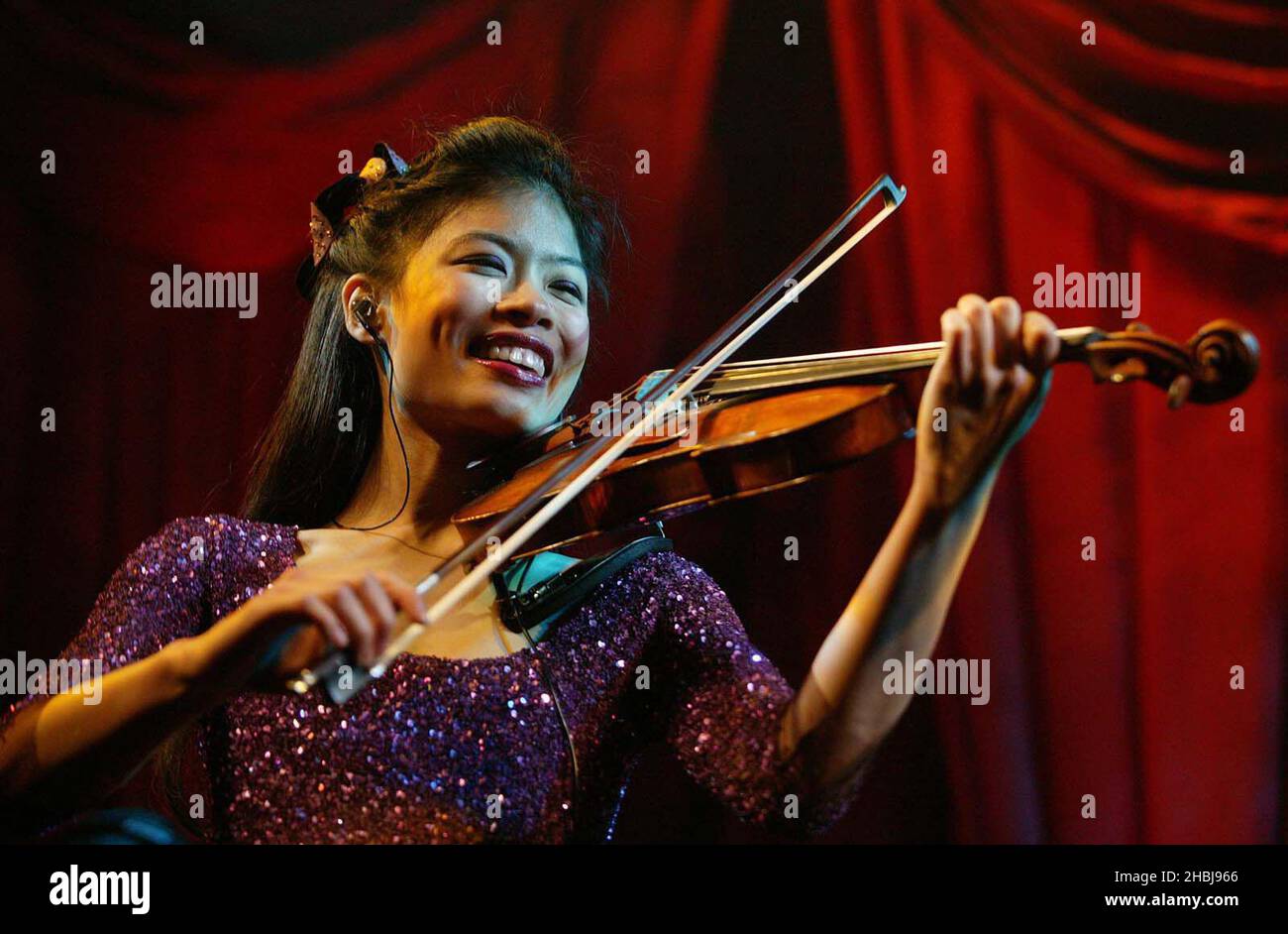 Vanessa Mae performs at the Classical Brit Awards nominations announcement at the Landmark Hotel in London. Stock Photo