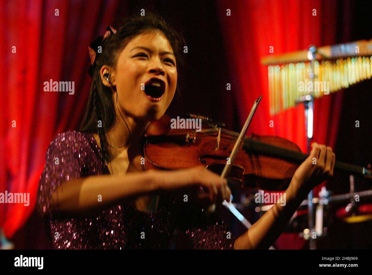 Vanessa Mae performs at the Classical Brit Awards nominations announcement at the Landmark Hotel in London. Stock Photo