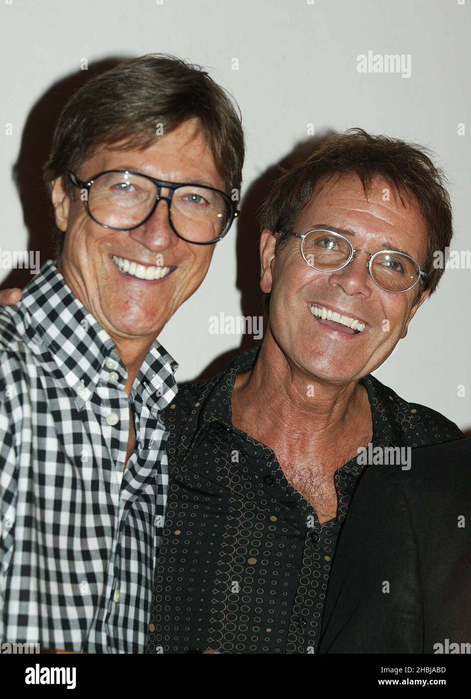 Cliff Richard and his former backing band The Shadows reunite for a photocall prior to the band's final date of last ever tour, at the London Palladium on June 14, 2004 in London. Cliff presents his former backing band with a special gold disc to mark over 100,000 sales of double CD 'Life Story - The Very Best Of The Shadows' which has been in the UK album charts since its release in April.   Hank B Marvin Stock Photo