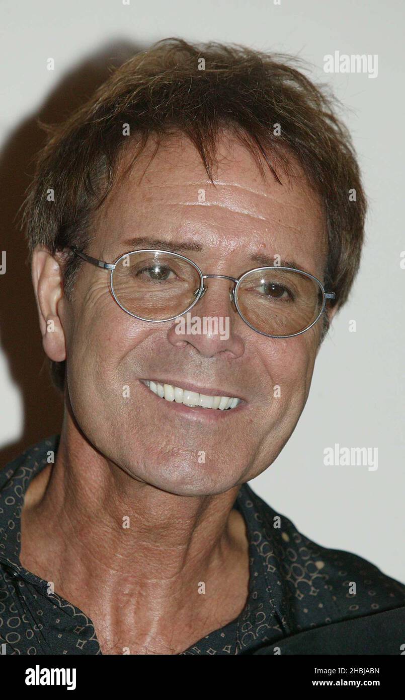 Cliff Richard and his former backing band The Shadows reunite for a photocall prior to the band's final date of last ever tour, at the London Palladium on June 14, 2004 in London. Cliff presents his former backing band with a special gold disc to mark over 100,000 sales of double CD 'Life Story - The Very Best Of The Shadows' which has been in the UK album charts since its release in April.  Cliff Richard, Stock Photo