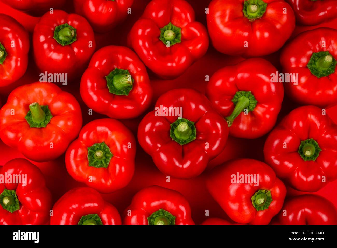 Fresh red bell pepper background Stock Photo - Alamy