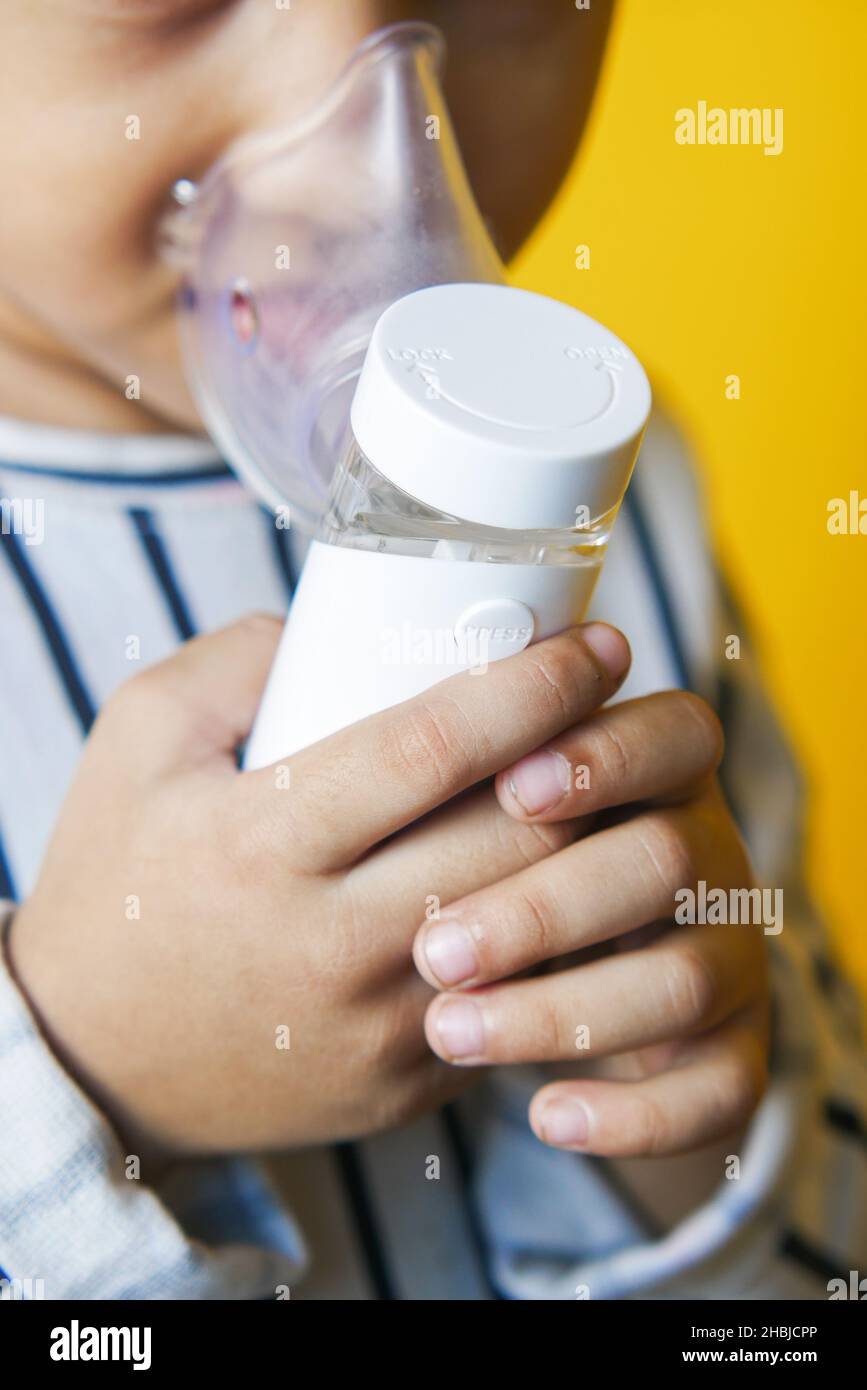 child girl using a nebulizer close up Stock Photo Alamy