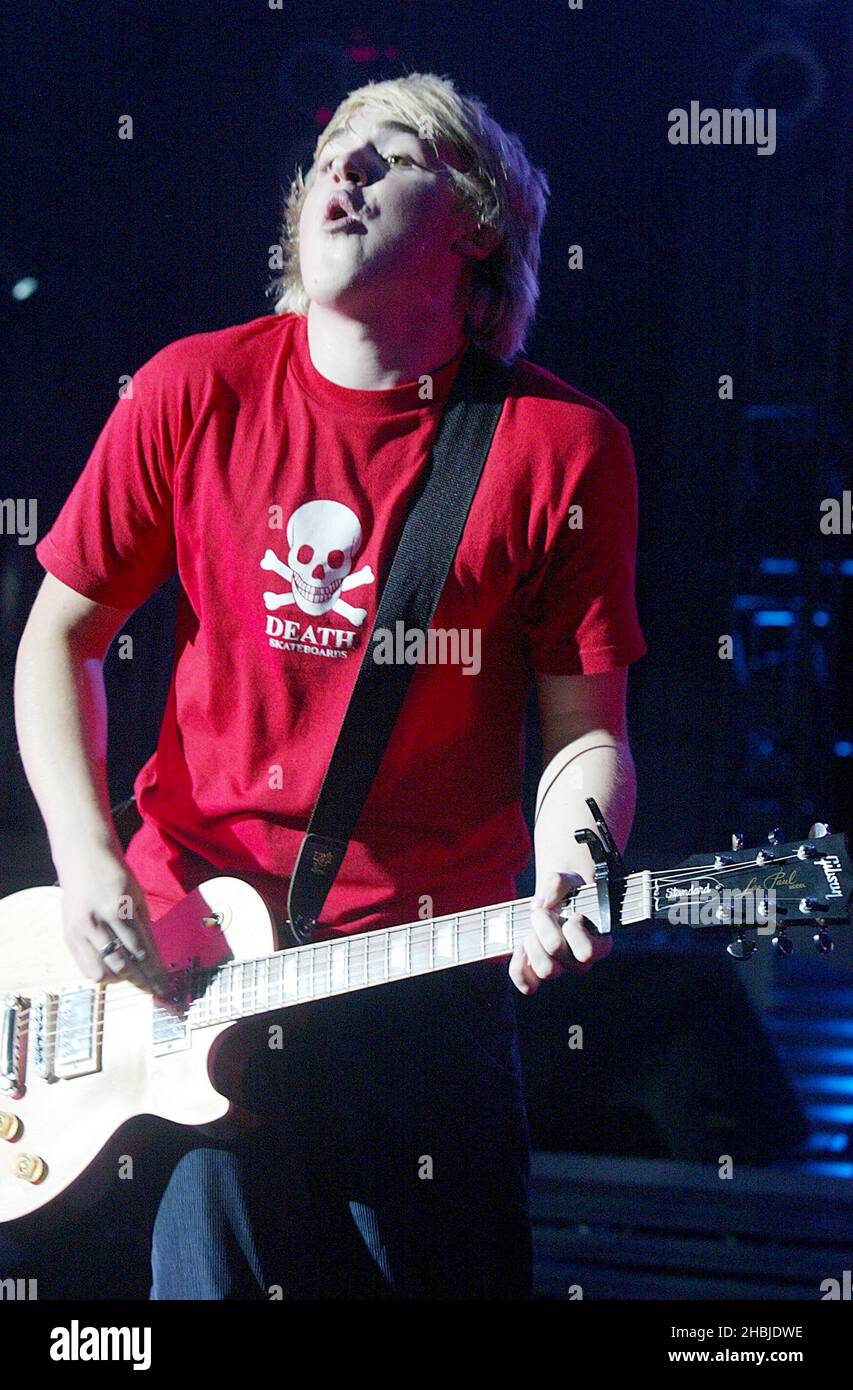 Tom Fletcher of McFly performs on stage on the penultimate night of their tour plugging debut album 'Room On The 3rd Floor' at the Carling Apollo Hammersmith on October 12, 2004 Stock Photo