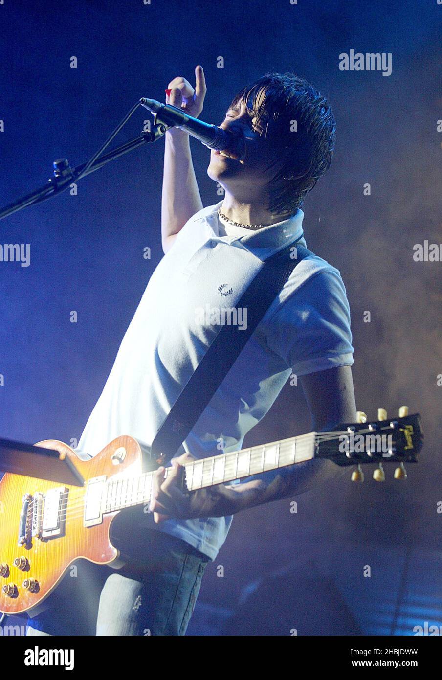 Danny Jones of McFly performs on stage on the penultimate night of their tour plugging debut album 'Room On The 3rd Floor' at the Carling Apollo Hammersmith on October 12, 2004 Stock Photo