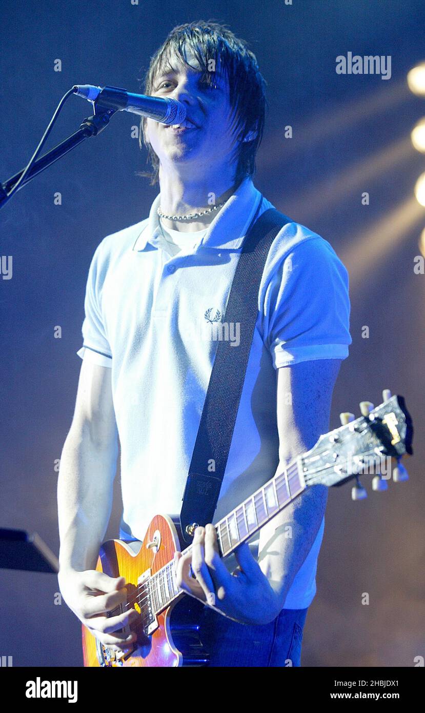Danny Jones of McFly performs on stage on the penultimate night of their tour plugging debut album 'Room On The 3rd Floor' at the Carling Apollo Hammersmith on October 12, 2004 Stock Photo