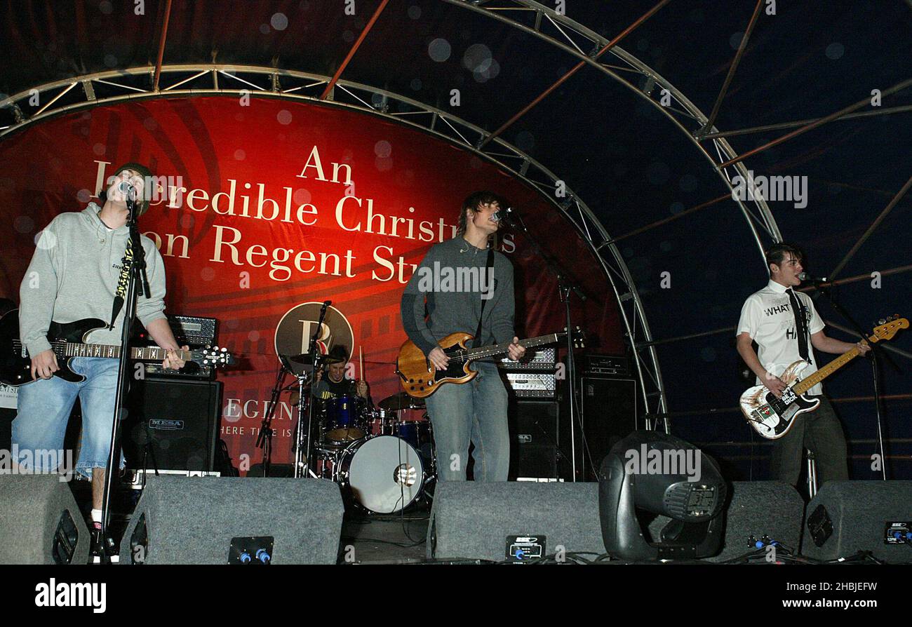 Busted James Bourne; Charlie Simpson; Matt Willis attend and perform on stage at the annual Regent Street Christmas Lights switching-on ceremony, having performed live, in Regent Street on November 7, 2004 in London. Stock Photo
