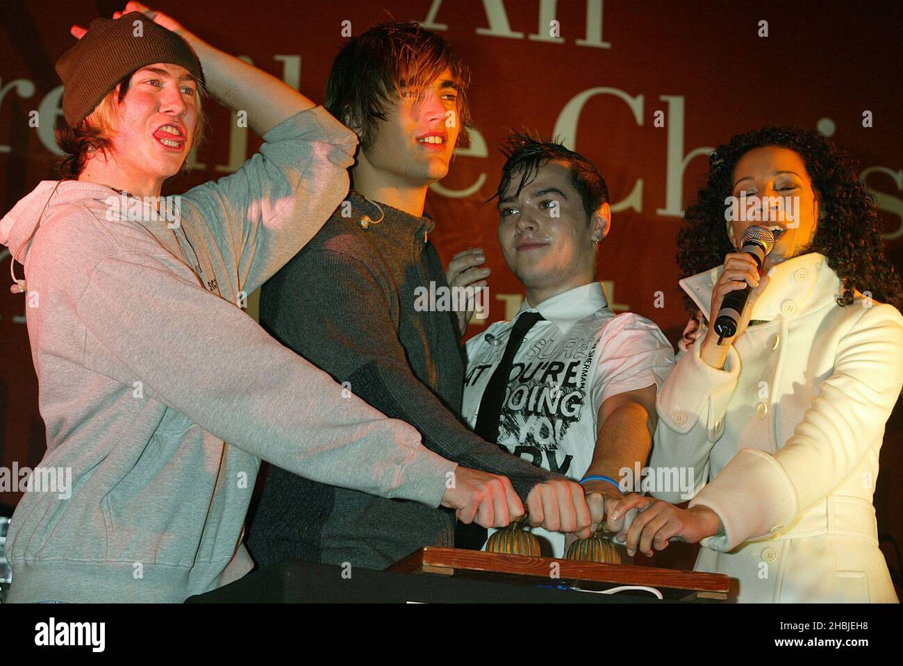 Busted James Bourne; Charlie Simpson; Matt Willis and Margerita Taylor attends the annual Regent Street Christmas Lights switching-on ceremony, having performed live, in Regent Street on November 7, 2004 in London. Stock Photo