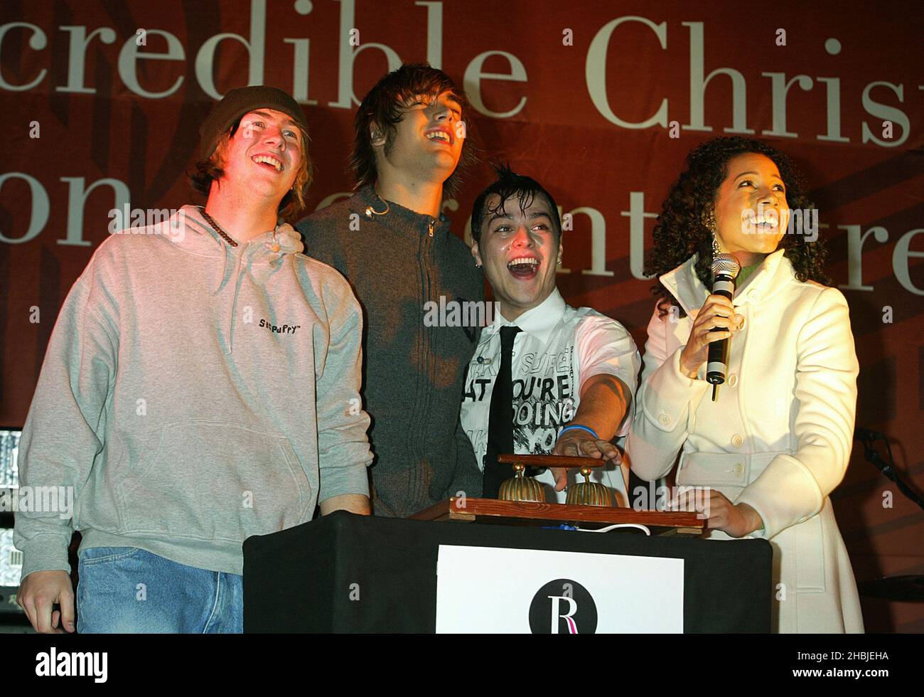 Busted James Bourne; Charlie Simpson; Matt Willis and Margerita Taylor attends the annual Regent Street Christmas Lights switching-on ceremony, having performed live, in Regent Street on November 7, 2004 in London. Stock Photo