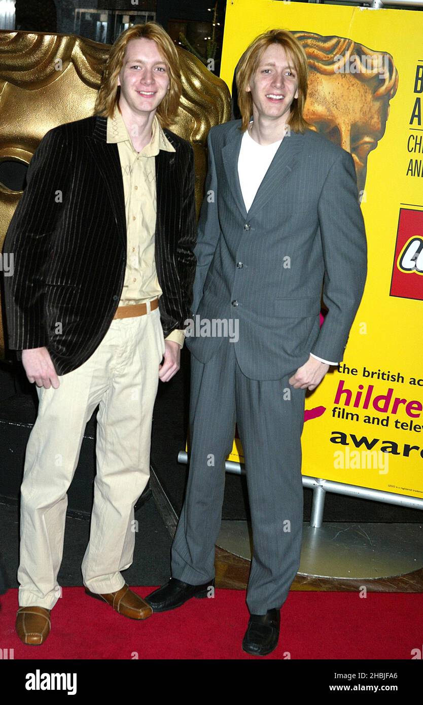 Jamie and Oliver Phelps pose at arrivals at the 'British Academy Children's Film & Television Awards' at the London Hilton, Park Lane on November 27, 2004 in London. Stock Photo