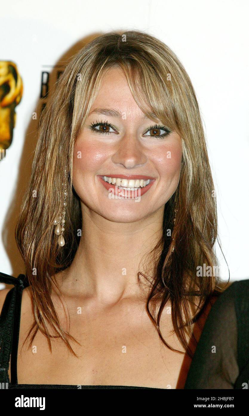 Ellie Crisell poses at the boards in the press room at the 