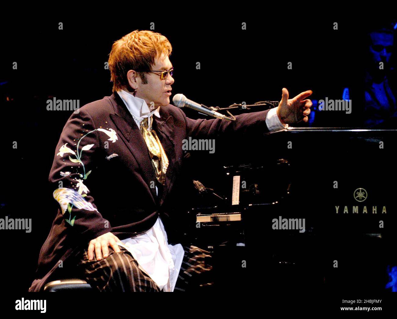 Elton John performing live in concert at the Hammersmith Apollo, west London. Stock Photo