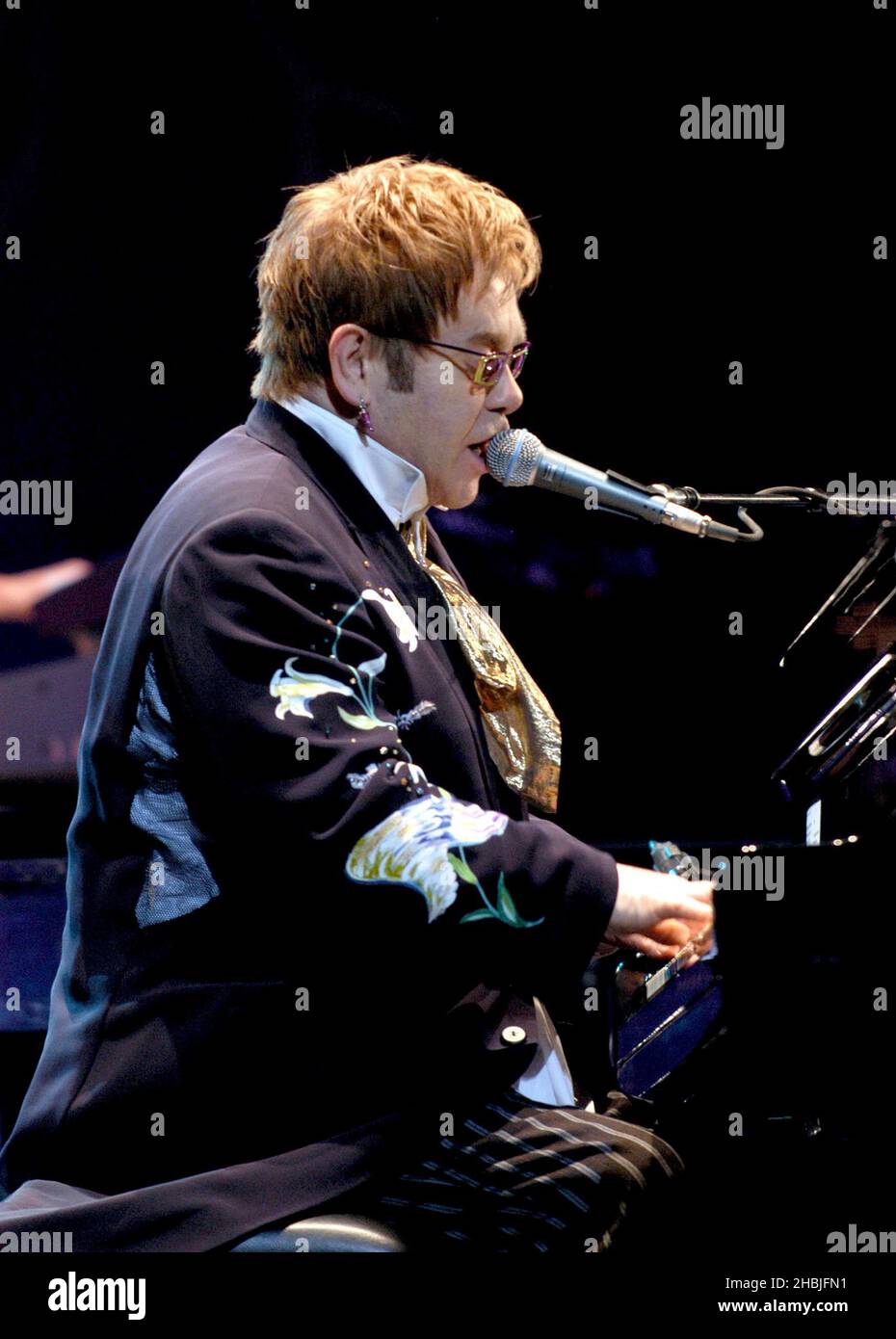 Elton John performing live in concert at the Hammersmith Apollo, west London. Stock Photo