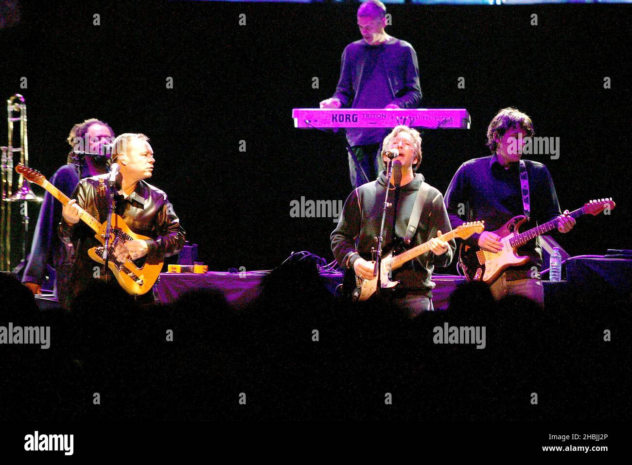 Eric clapton performing on stage with ub40 hi-res stock