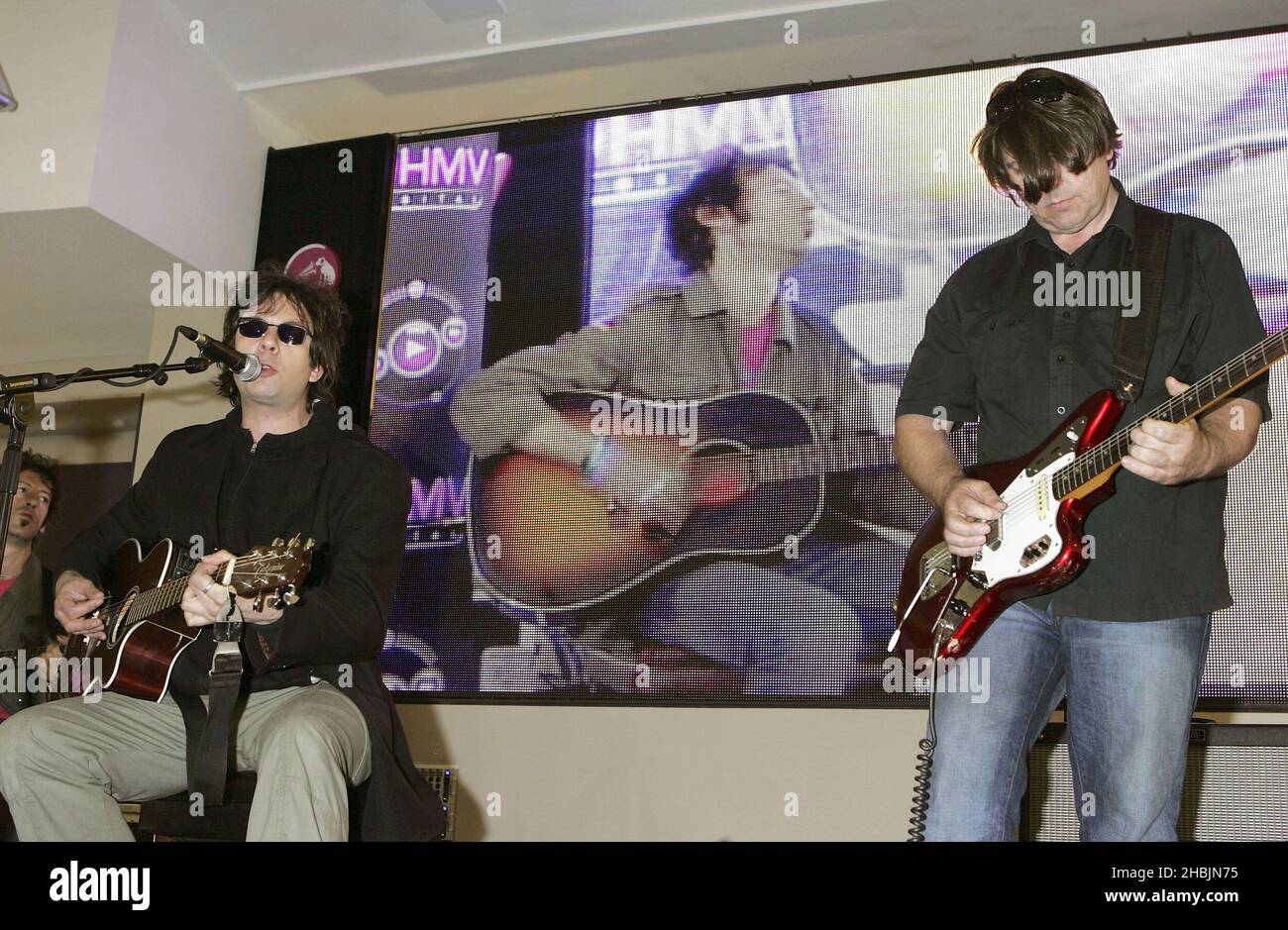 Ian McCulloch and Will Sergeant of Echo and the Bunnymen play an acoustic gig and sign records to celebrate the launch of HMV's digital download service at HMV on Oxford Street, London. Stock Photo