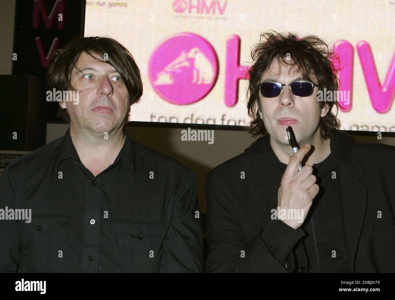 Ian McCulloch and Will Sergeant of Echo and the Bunnymen play an acoustic gig and sign records to celebrate the launch of HMV's digital download service at HMV on Oxford Street, London. Stock Photo