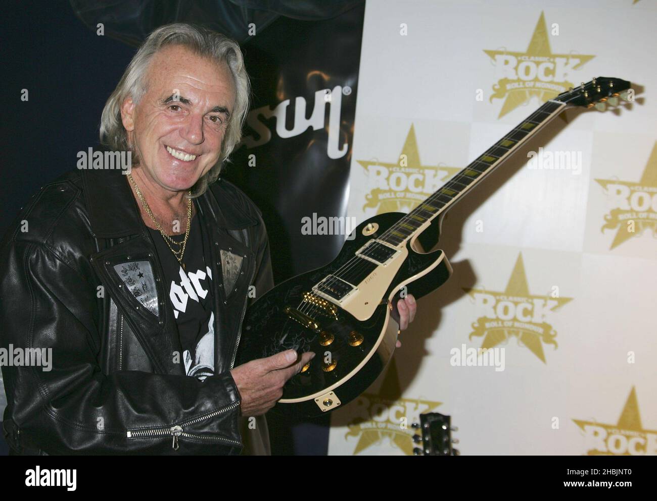 Peter Stringfellow with Gibson Guitar in the Awards room, at the Classic Rock Roll Of Honour at Cafe de Paris on October 4, 2005 in London. Stock Photo