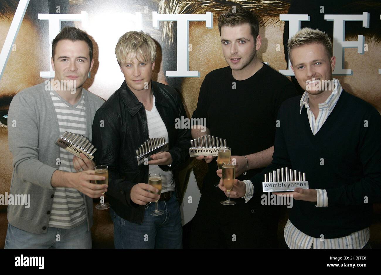 (left-right) Shane Filan, Kian Egan, Mark Feehily, Nicky Byrne of Westlife with an award for the pop act that has performed at Wembley Arena the most times ever. Stock Photo