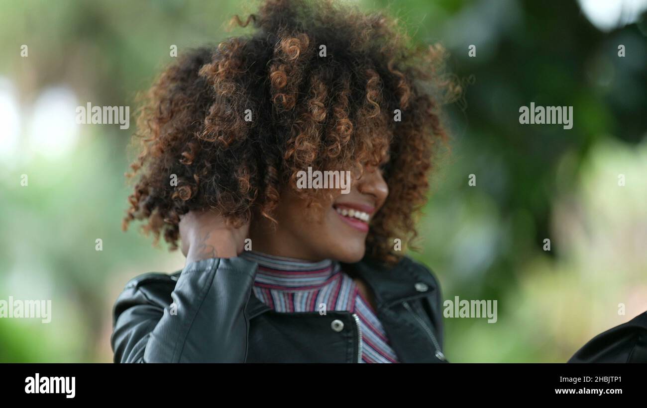 Adjusting woman curly hair hi-res stock photography and images - Alamy