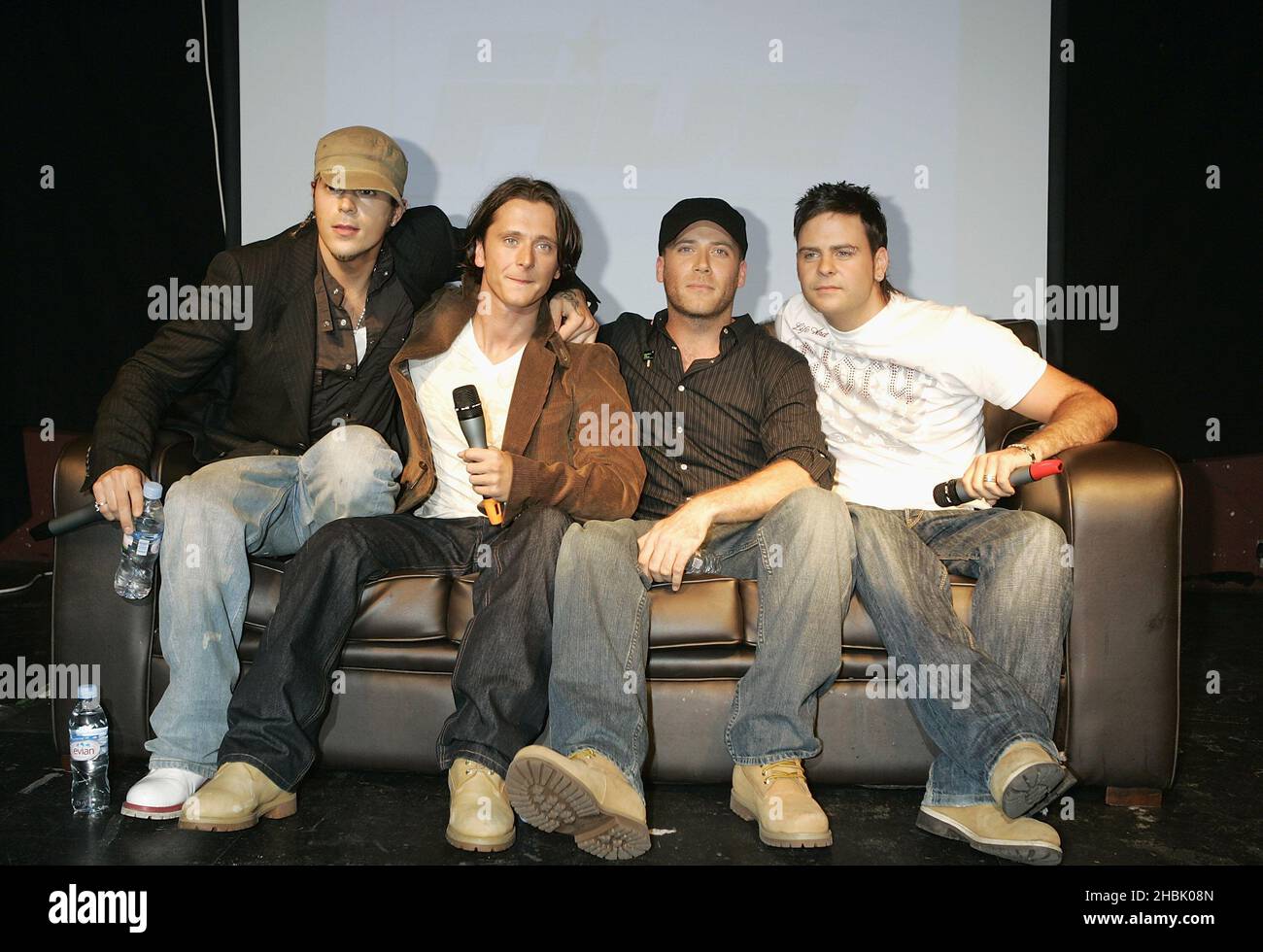Pop band Five (from left to right) Abs (Richard Breen), Ritchie Neville, J (Jason 'J' Brown) and Scott Robinson - who now comprise four members - during a press conference to announce their reunion, at Bar Academy in Islington, north London. Stock Photo