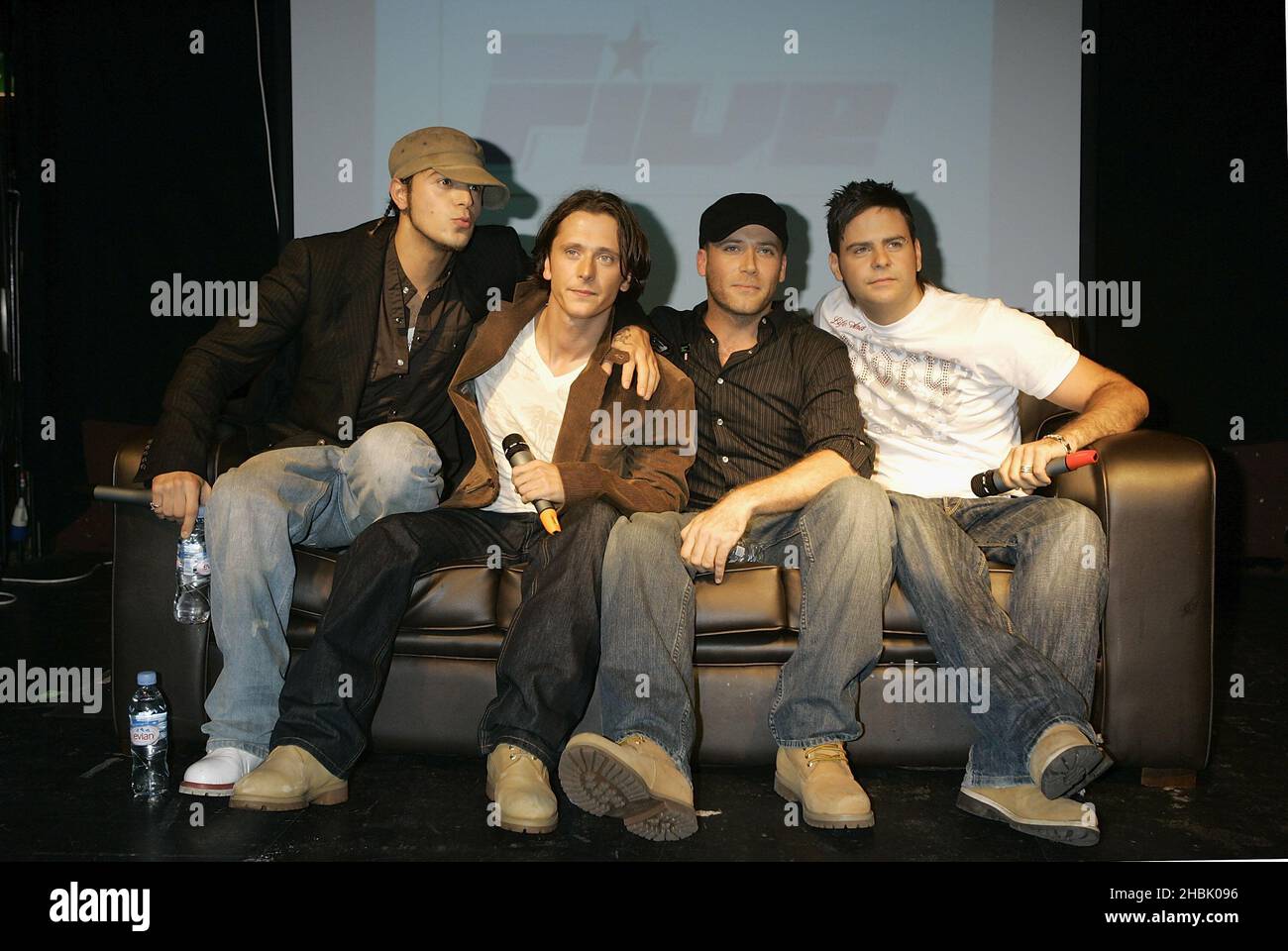 Pop band Five (from left to right) Abs (Richard Breen), Ritchie Neville, J (Jason 'J' Brown) and Scott Robinson - who now comprise four members - during a press conference to announce their reunion, at Bar Academy in Islington, north London. Stock Photo