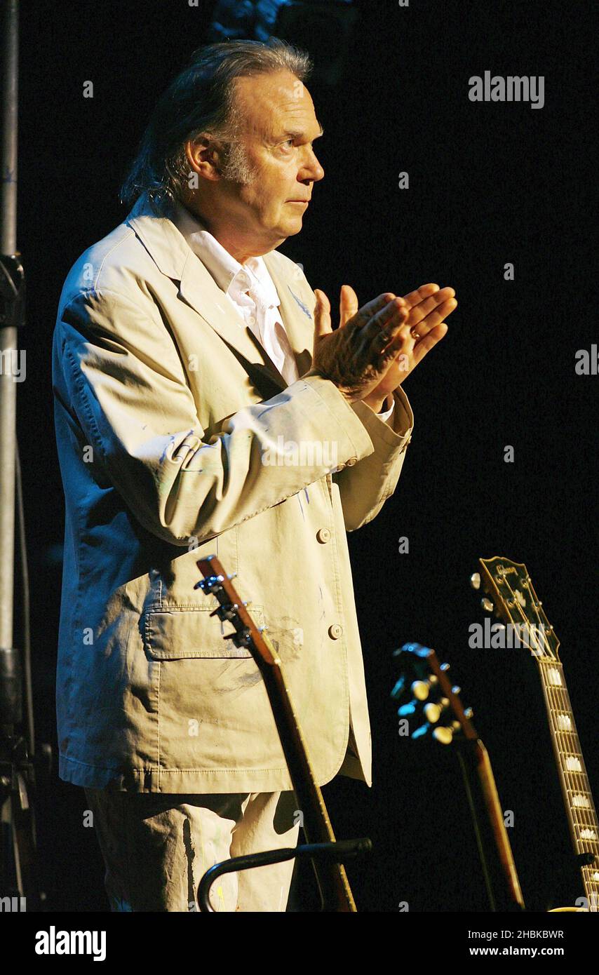 Neil Young performing the acoustic half of his concert at the Hammersmith Apollo in west London. Stock Photo