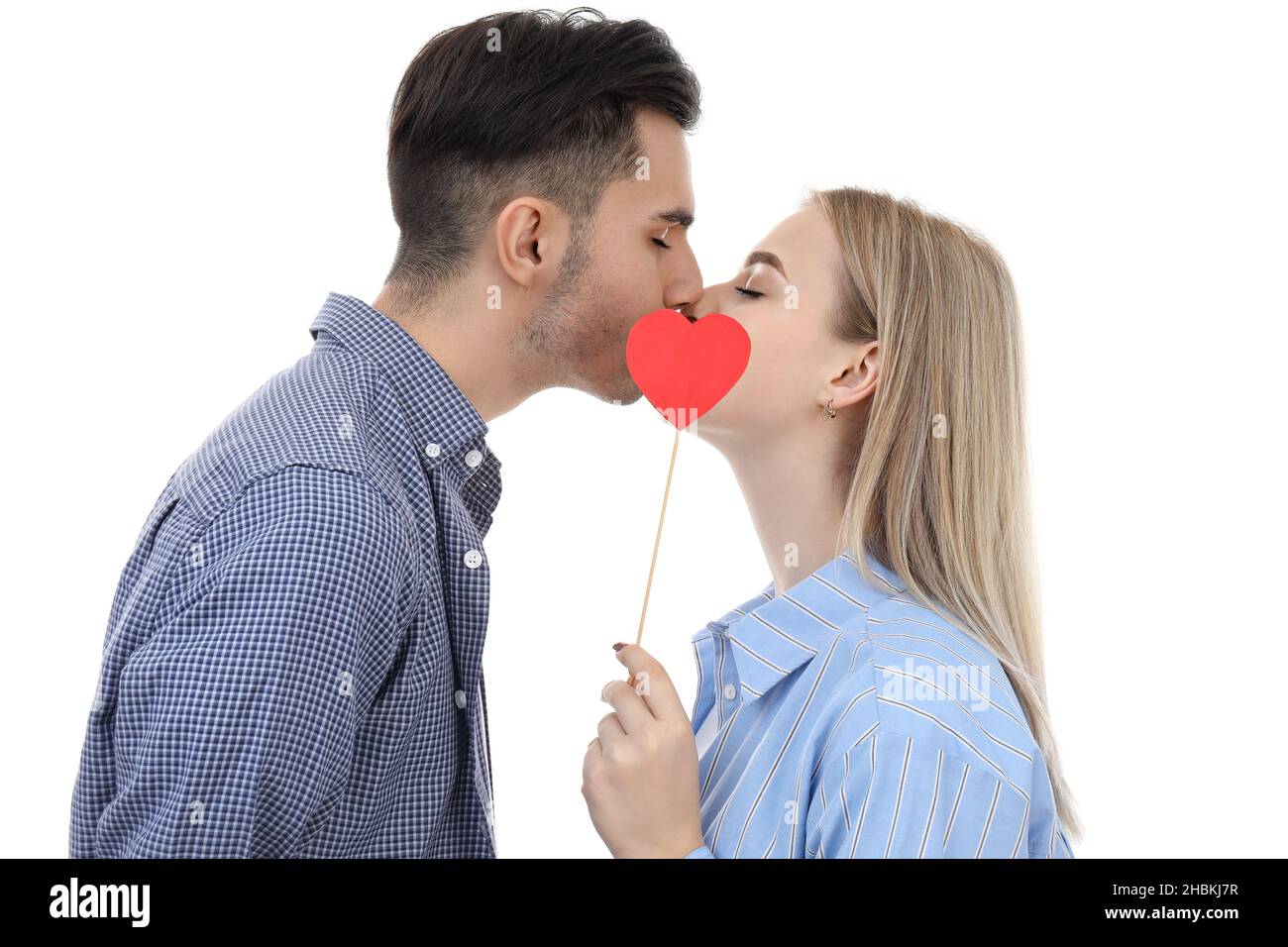 Cute couple with heart isolated on white background Stock Photo - Alamy