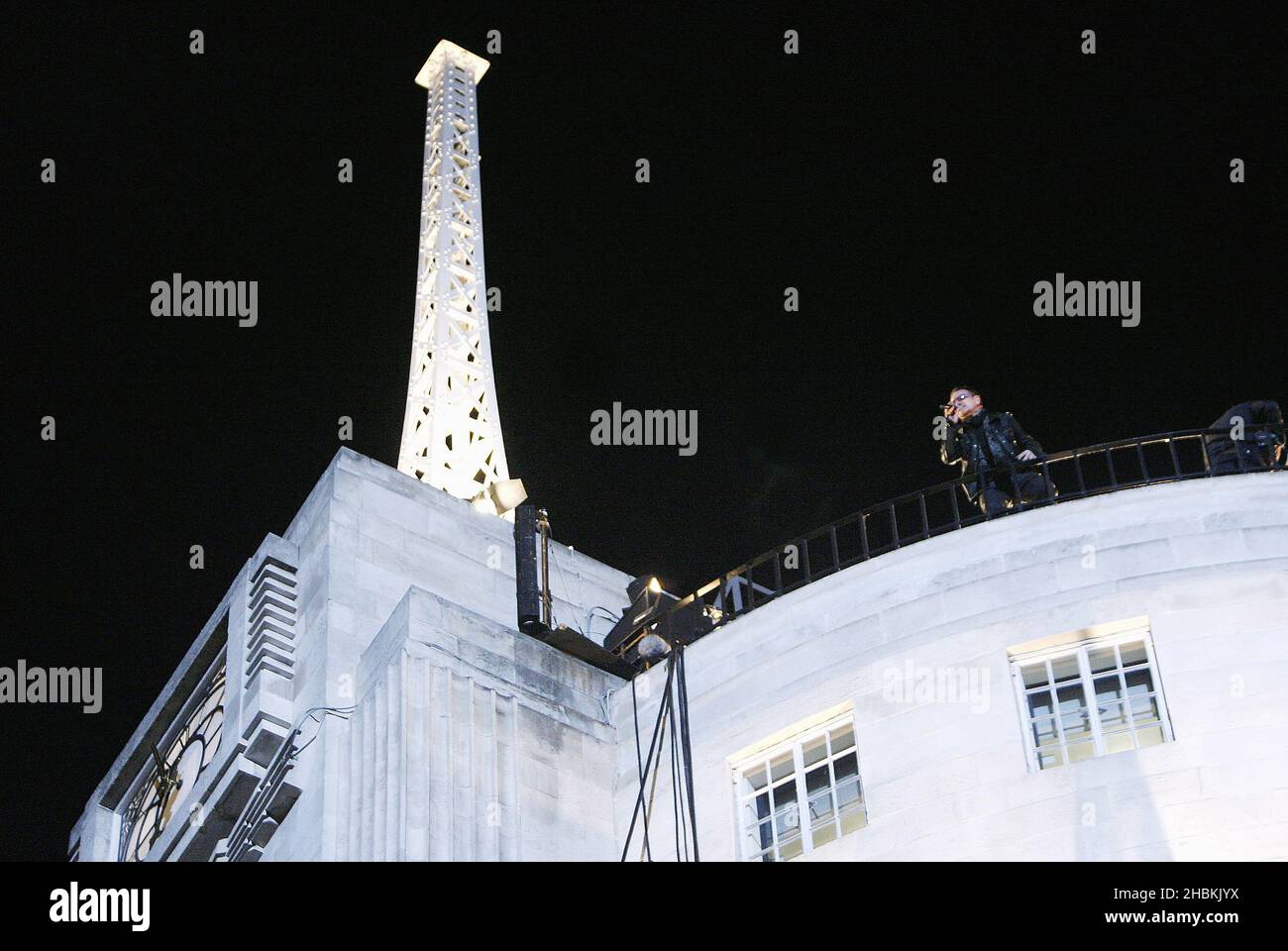 U2 perform several songs on top of BBC Broadcasting House in Portland Place, central London this evening during a secret gig. Stock Photo