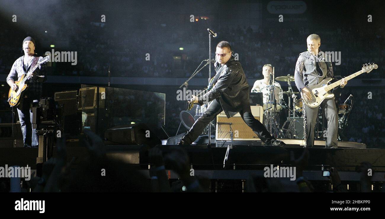 Bono performs with U2 at Wembley Stadium in London, UK Stock Photo