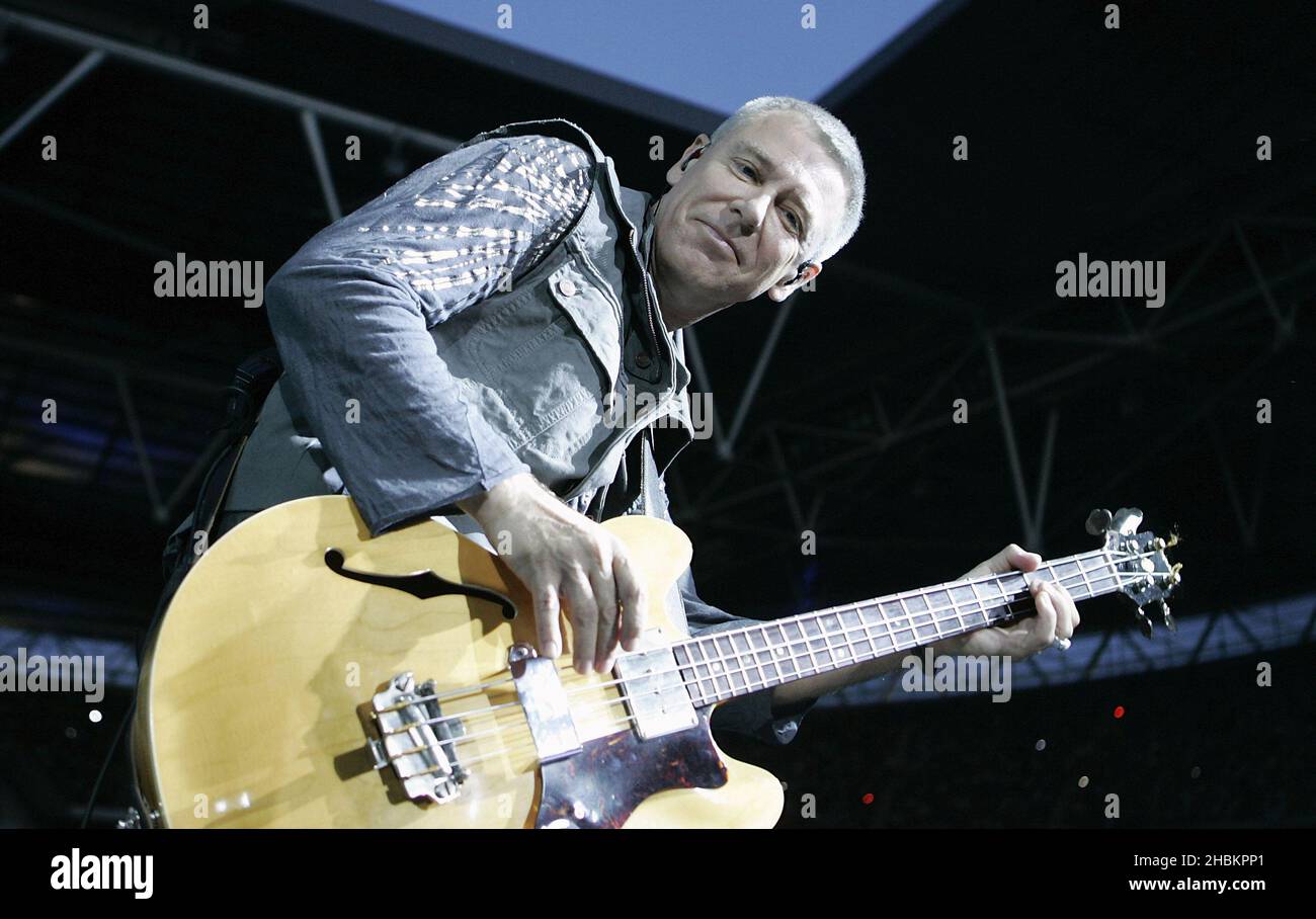 Adam Clayton performs with U2 at Wembley Stadium in London, UK Stock Photo
