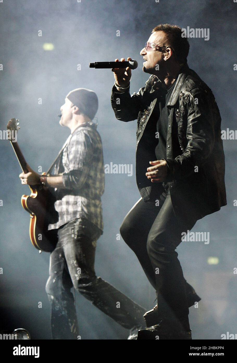 Bono performs with U2 at Wembley Stadium in London, UK Stock Photo