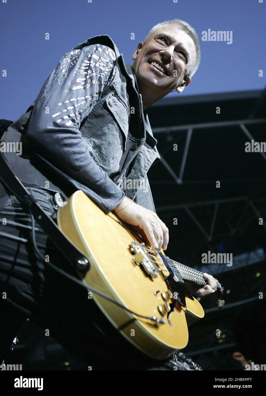 Adam Clayton performs with U2 at Wembley Stadium in London, UK Stock Photo