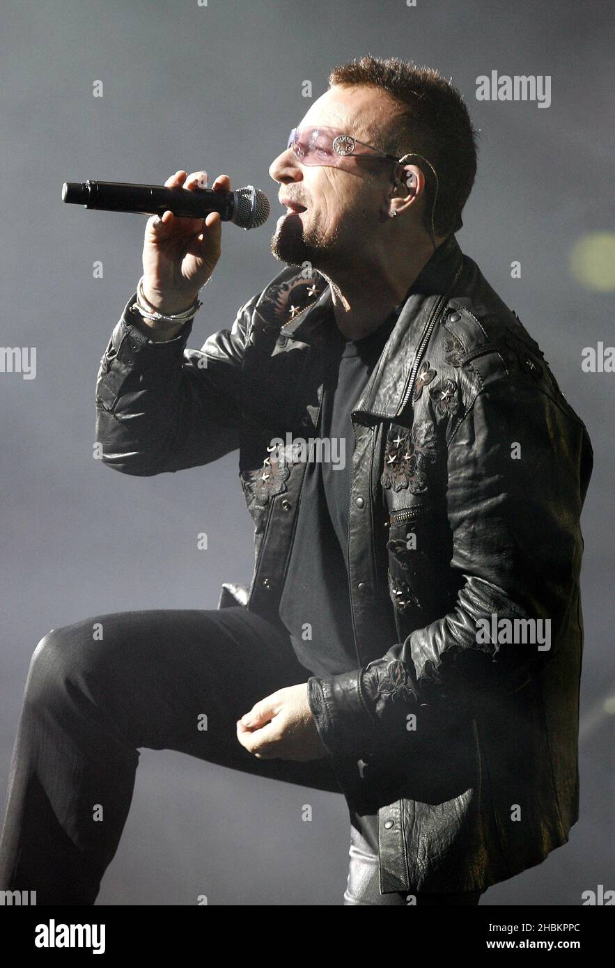 Bono performs with U2 at Wembley Stadium in London, UK Stock Photo