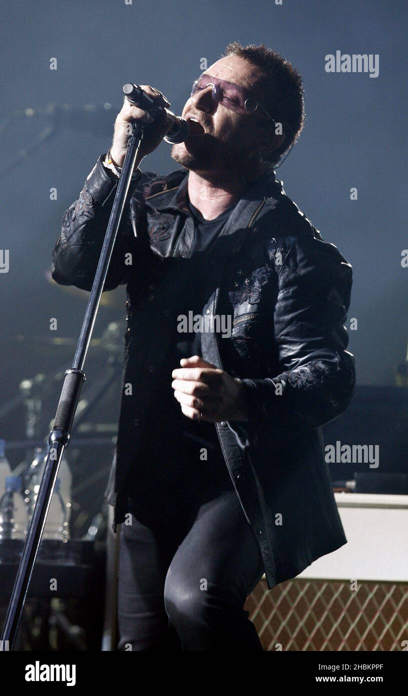 Bono performs with U2 at Wembley Stadium in London, UK Stock Photo