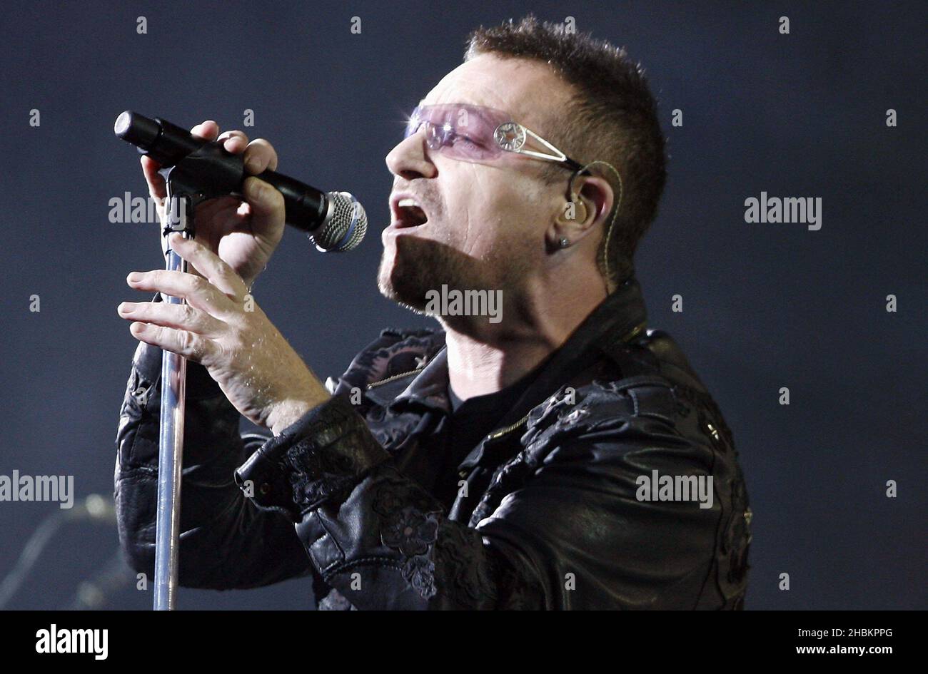 Bono performs with U2 at Wembley Stadium in London, UK Stock Photo