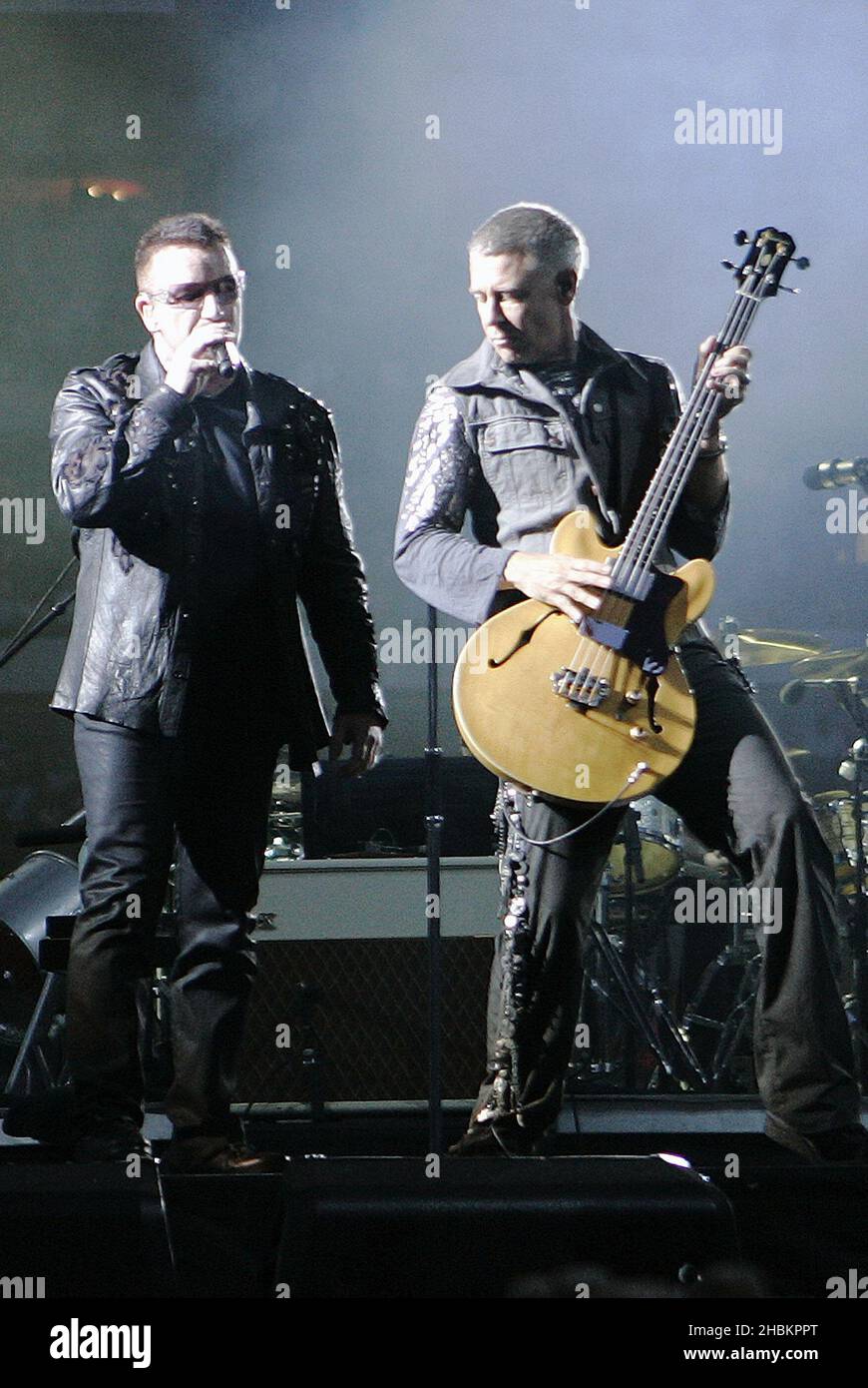 Bono and Adam Clayton of U2 perform at Wembley Stadium in London, UK Stock Photo