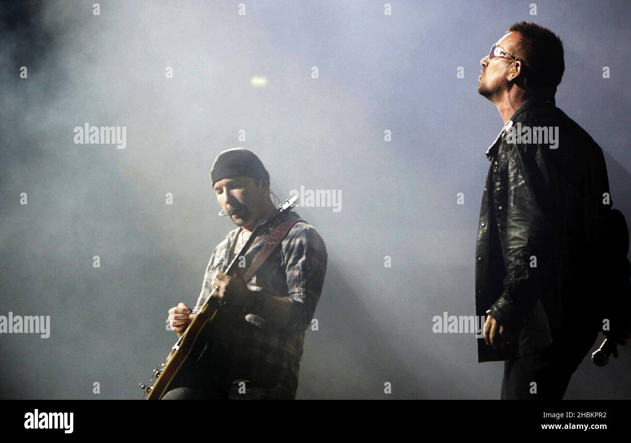 Bono and The Edge perform with U2 at Wembley Stadium in London, UK Stock Photo
