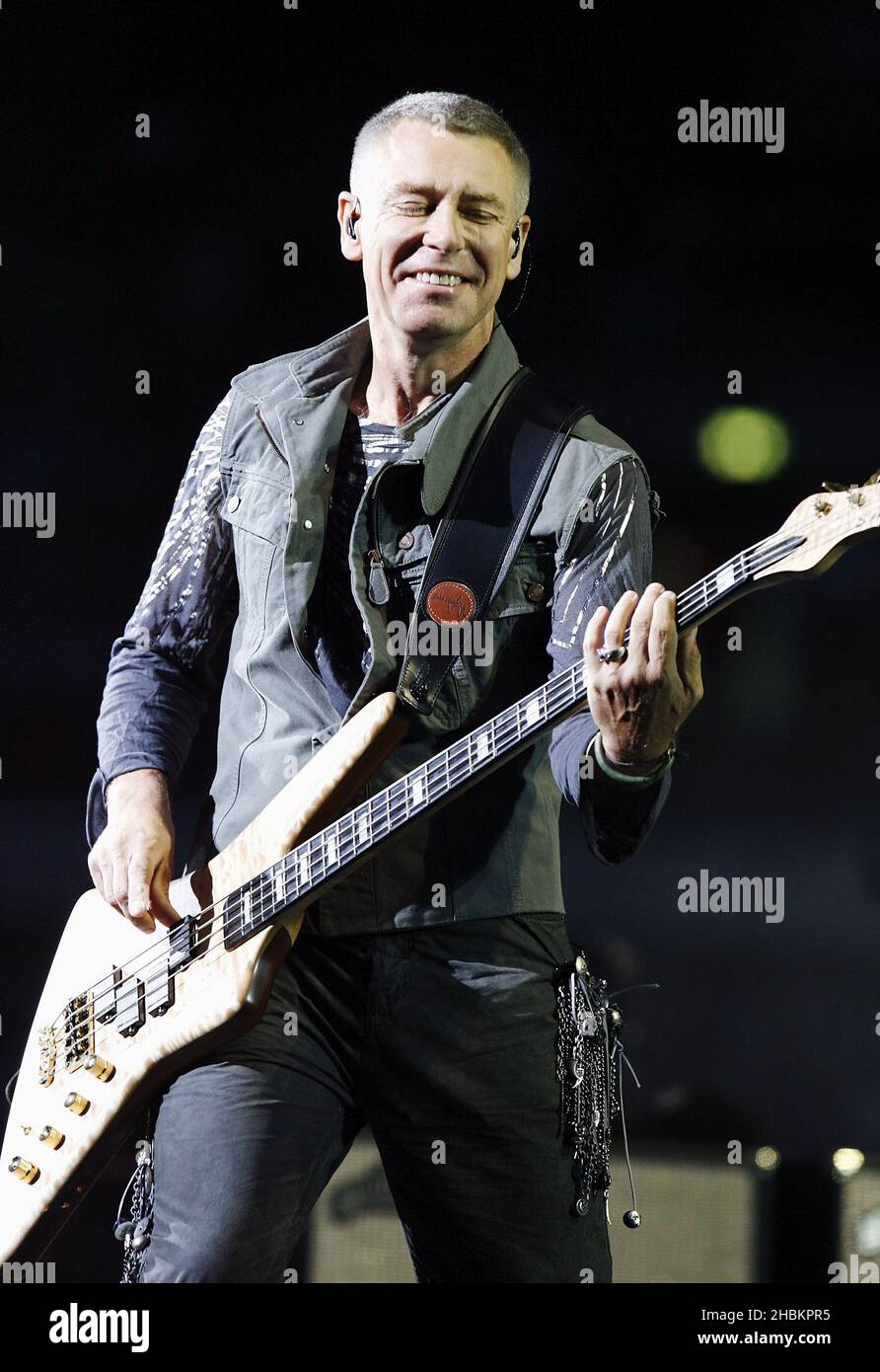 Adam Clayton of U2 perform at Wembley Stadium, London. Stock Photo