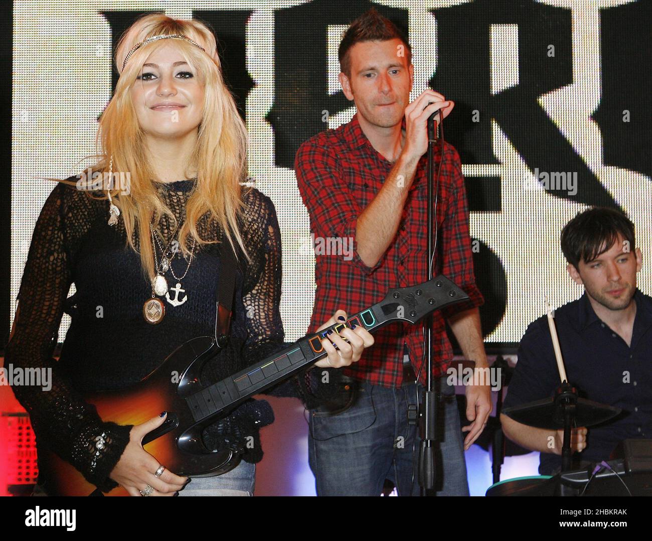 Pixie Lott launches the latest instalment of music making game, Guitar Hero at HMV Oxford Street in central London. Stock Photo