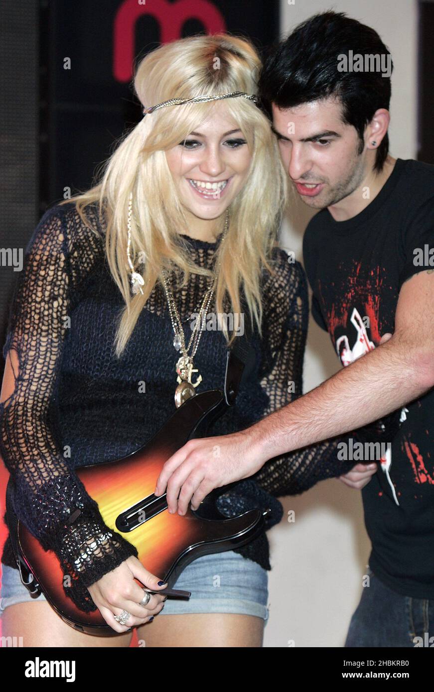 Pixie Lott launches the latest instalment of music making game, Guitar Hero at HMV Oxford Street in central London. Stock Photo